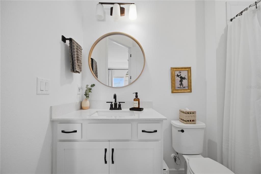 13816 Sharp Hawk Drive Riverview, FL 33569 - Photo 58 of 76 a bathroom with a toilet a sink and a mirror