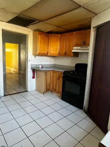 a kitchen with stainless steel appliances granite countertop a refrigerator a sink and dishwasher