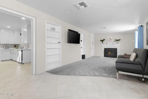 a kitchen with a stove top oven a sink dishwasher and a refrigerator with wooden floor