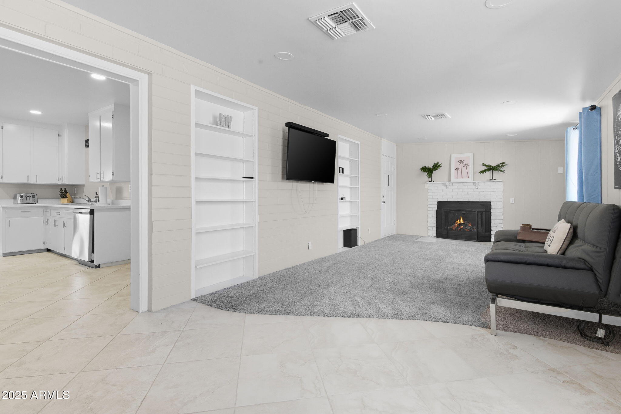 1802 East Meadowbrook Avenue Phoenix, AZ 85016 - Photo 10 of 28 a living room with furniture and a flat screen tv