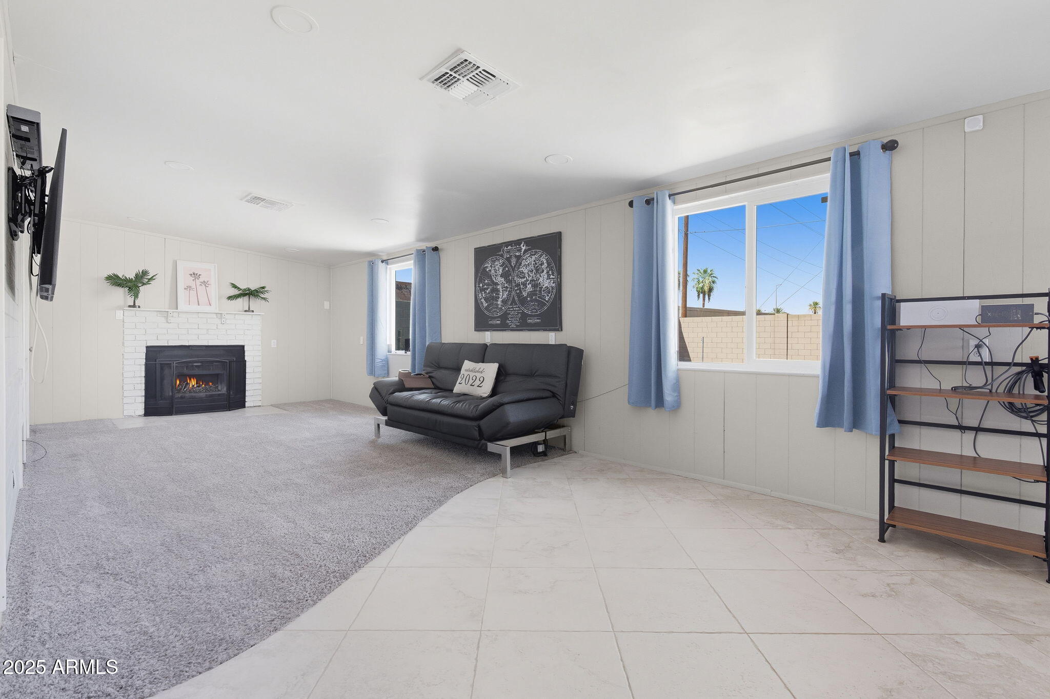 1802 East Meadowbrook Avenue Phoenix, AZ 85016 - Photo 11 of 28 a living room with furniture and a fireplace