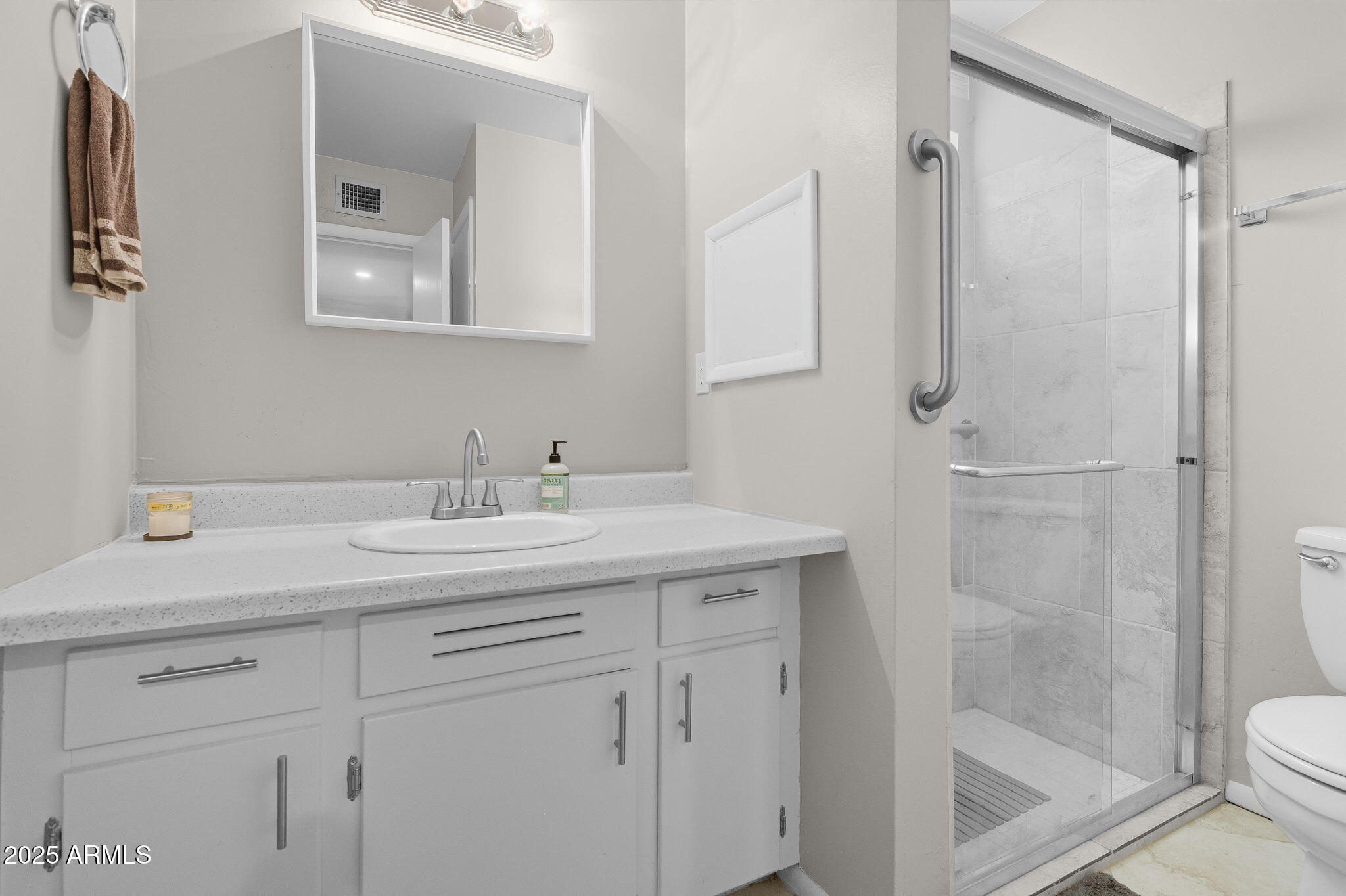 1802 East Meadowbrook Avenue Phoenix, AZ 85016 - Photo 14 of 28 a bathroom with a sink a toilet and shower