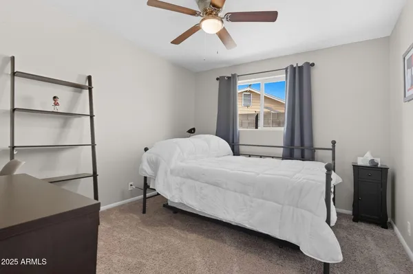 a bedroom with a bed and window