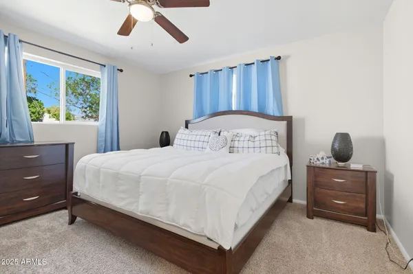 a bedroom with a bed and window