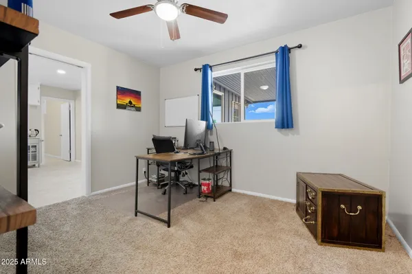 a view of a workspace with furniture