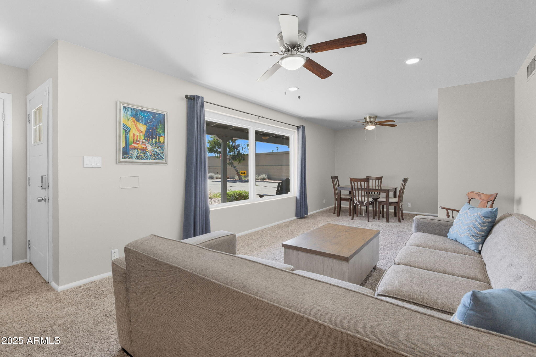 1802 East Meadowbrook Avenue Phoenix, AZ 85016 - Photo 2 of 28 a living room with furniture and a large window