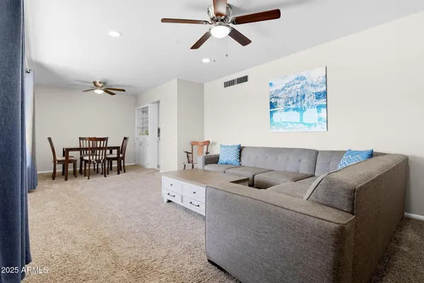 a living room with furniture and a large window