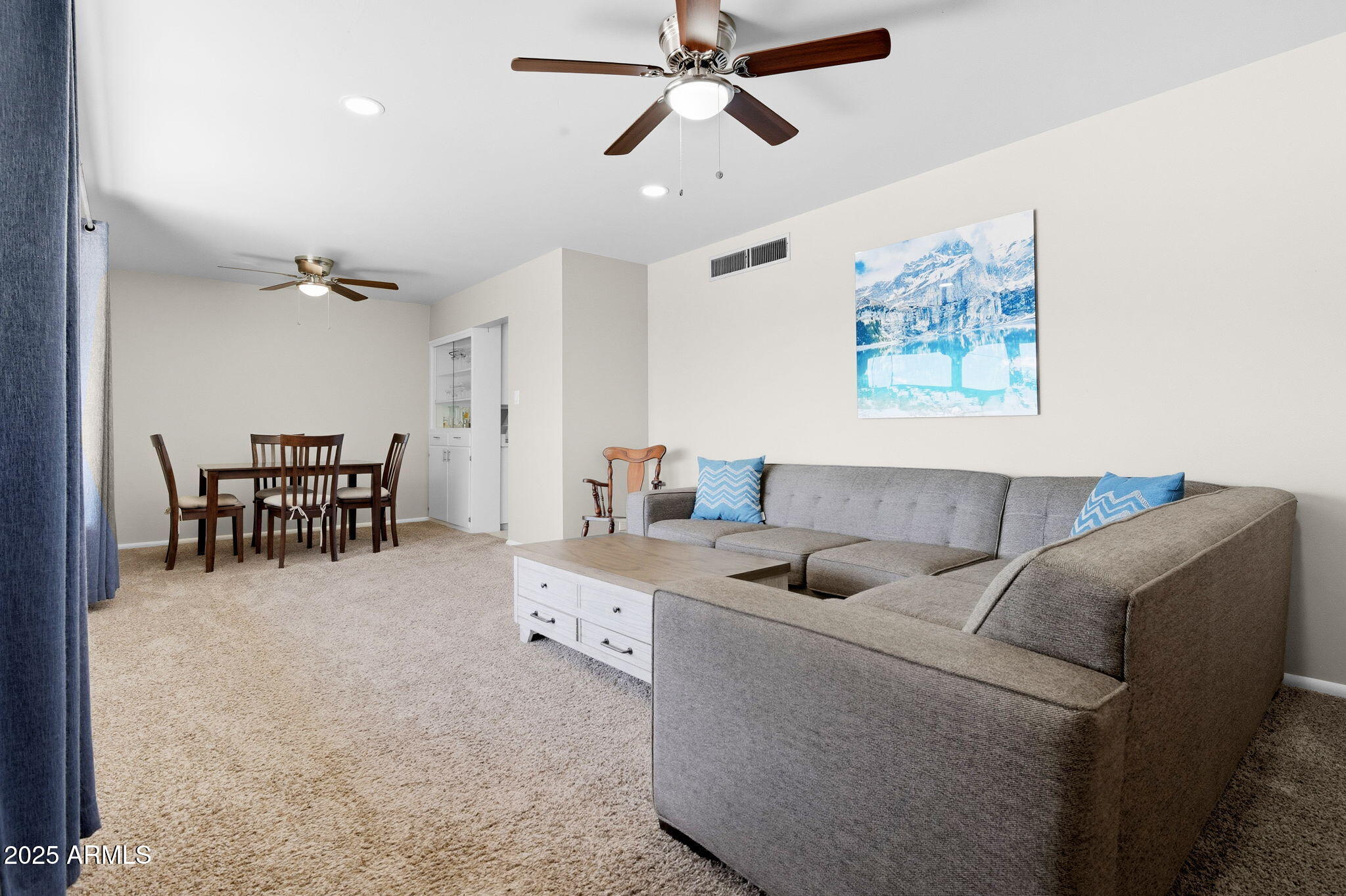 1802 East Meadowbrook Avenue Phoenix, AZ 85016 - Photo 3 of 28 a living room with furniture and a dining table