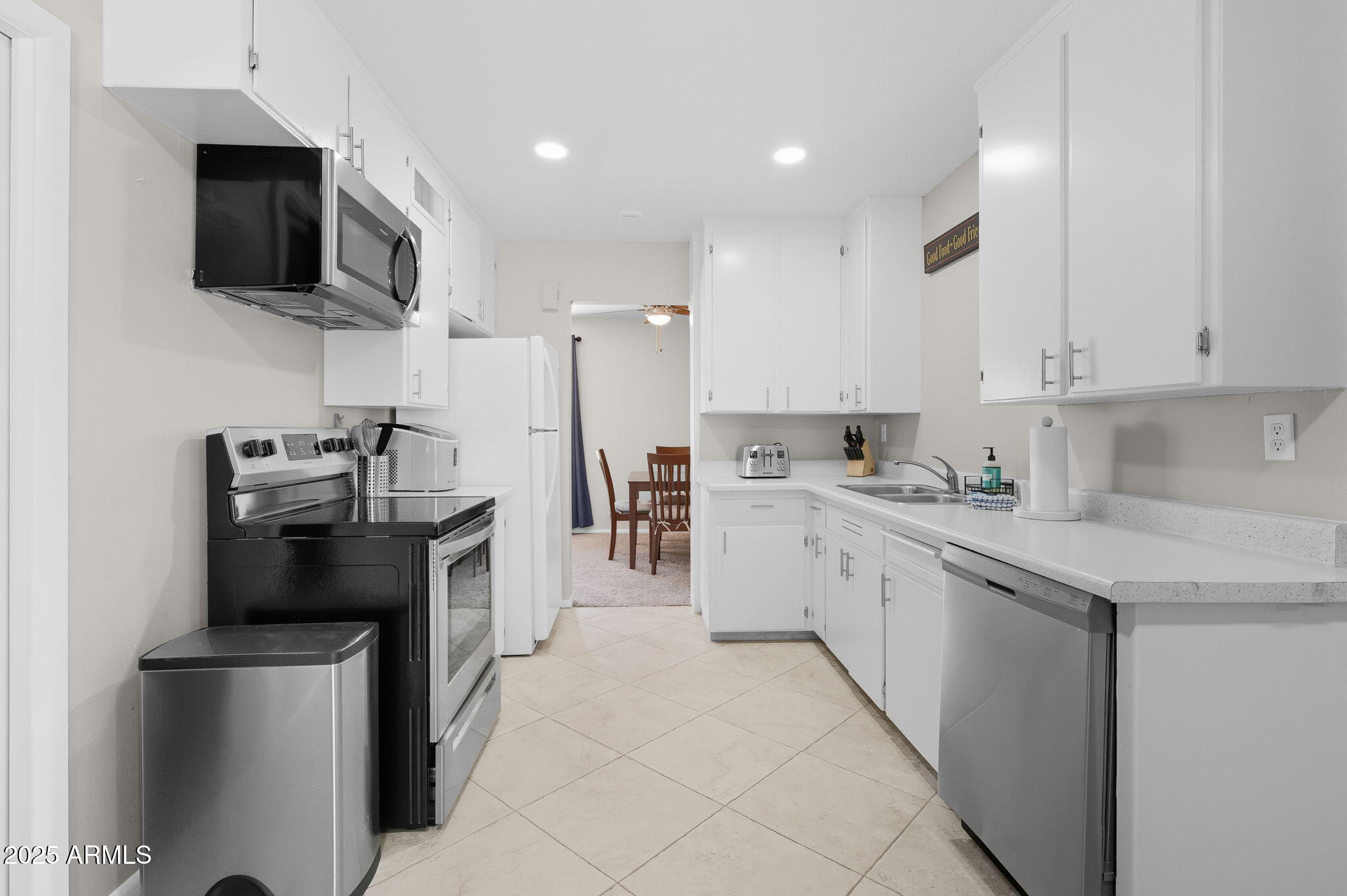 1802 East Meadowbrook Avenue Phoenix, AZ 85016 - Photo 7 of 28 a kitchen with stainless steel appliances granite countertop a refrigerator sink and microwave