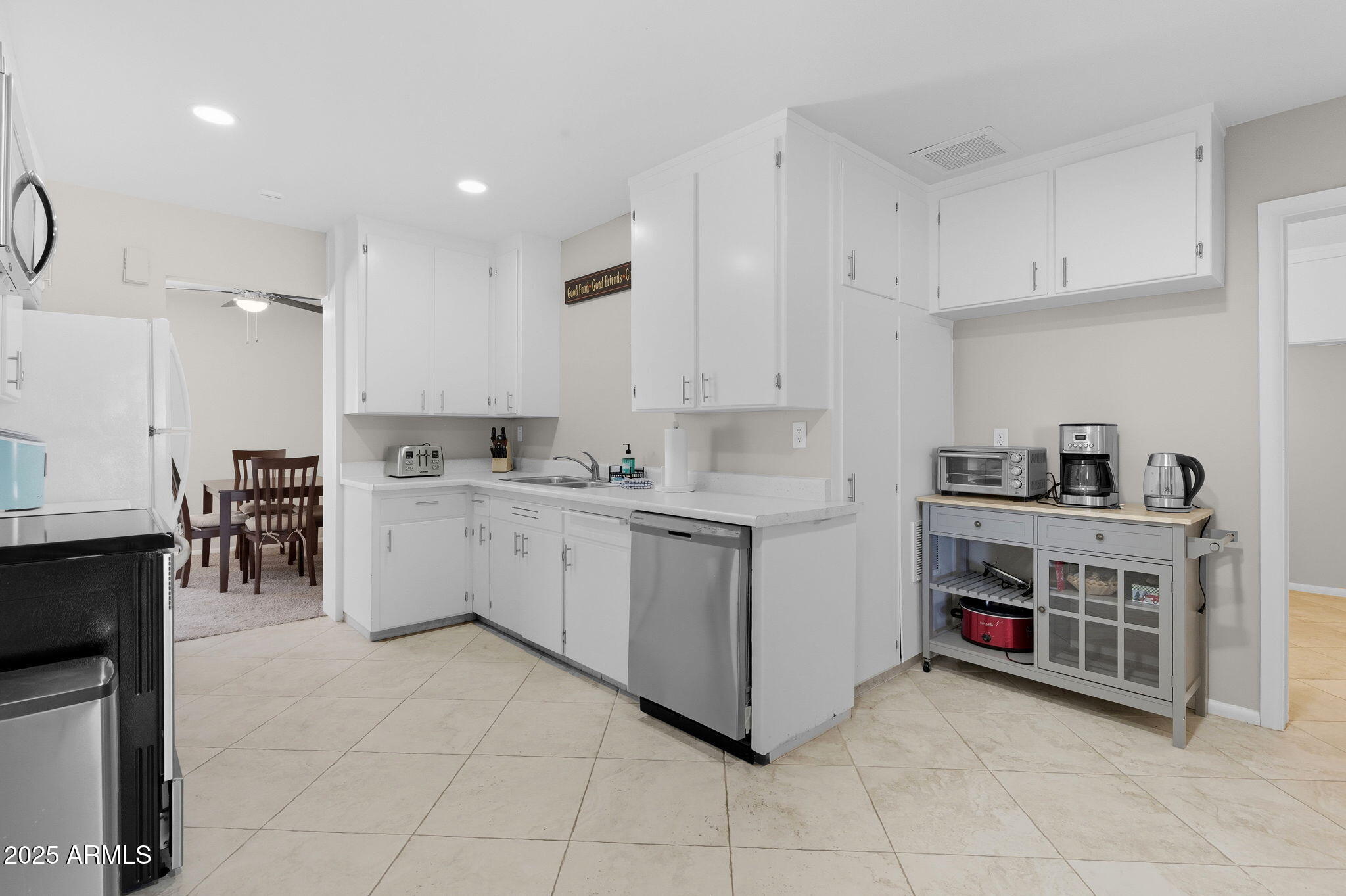 1802 East Meadowbrook Avenue Phoenix, AZ 85016 - Photo 8 of 28 a kitchen with cabinets and window