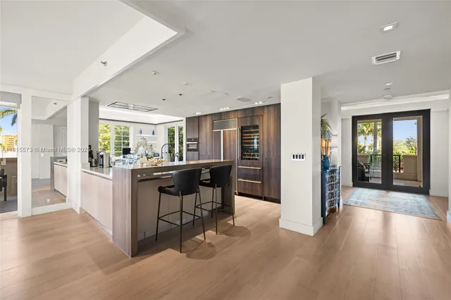 a large kitchen with a counter space and stainless steel appliances