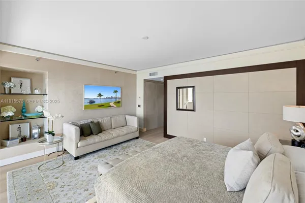 a view of a porch with a bench and floor to ceiling window