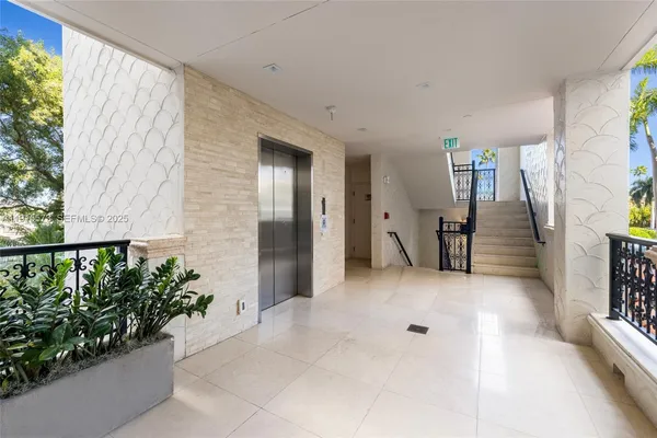 a view of a building with sitting area