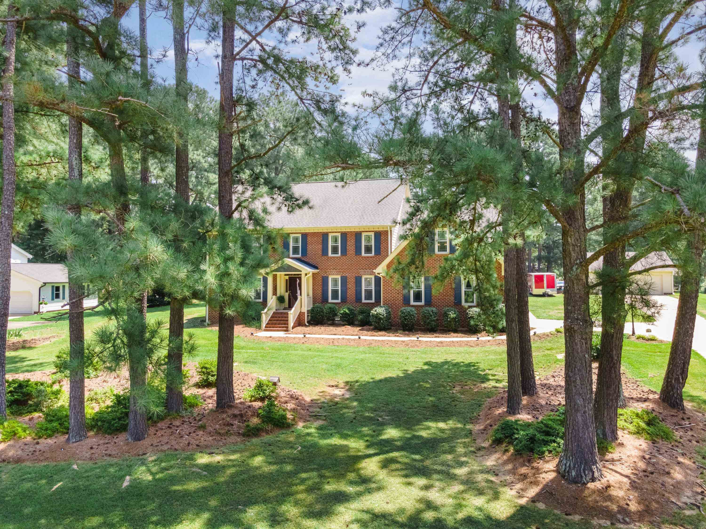 8501 Crowder Road Raleigh, NC 27603 - Photo 4 of 60 The curb appeal of this stately brick custom home is sure to impress. Front Yard