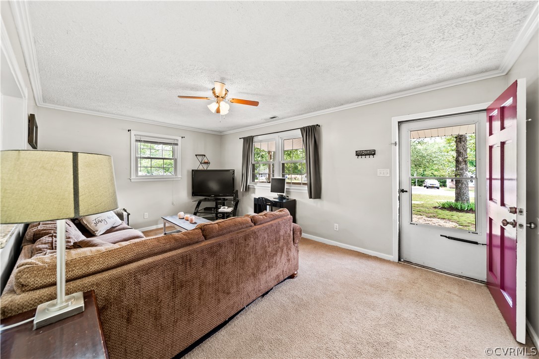 15601 Saddlebrook Road Chesterfield, VA 23838 - Photo 6 of 34 a living room with furniture and a flat screen tv