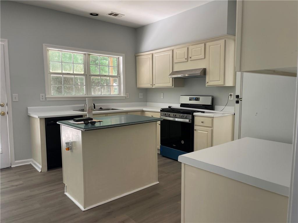3118 Stanstead Court Norcross, GA 30071 - Photo 5 of 14 a kitchen with a sink stove top oven and cabinets
