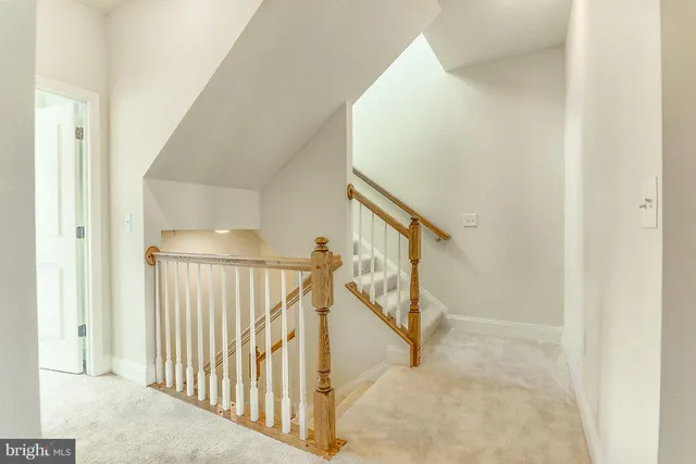a view of a hallway with staircase