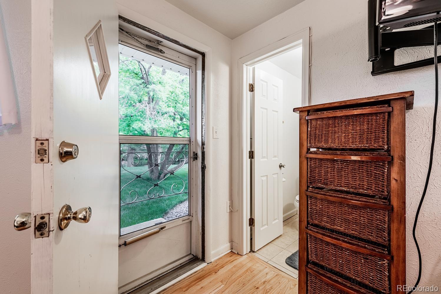 13895 Braun Road Golden, CO 80401 - Photo 15 of 40 a view of a hallway with wooden floor and windows