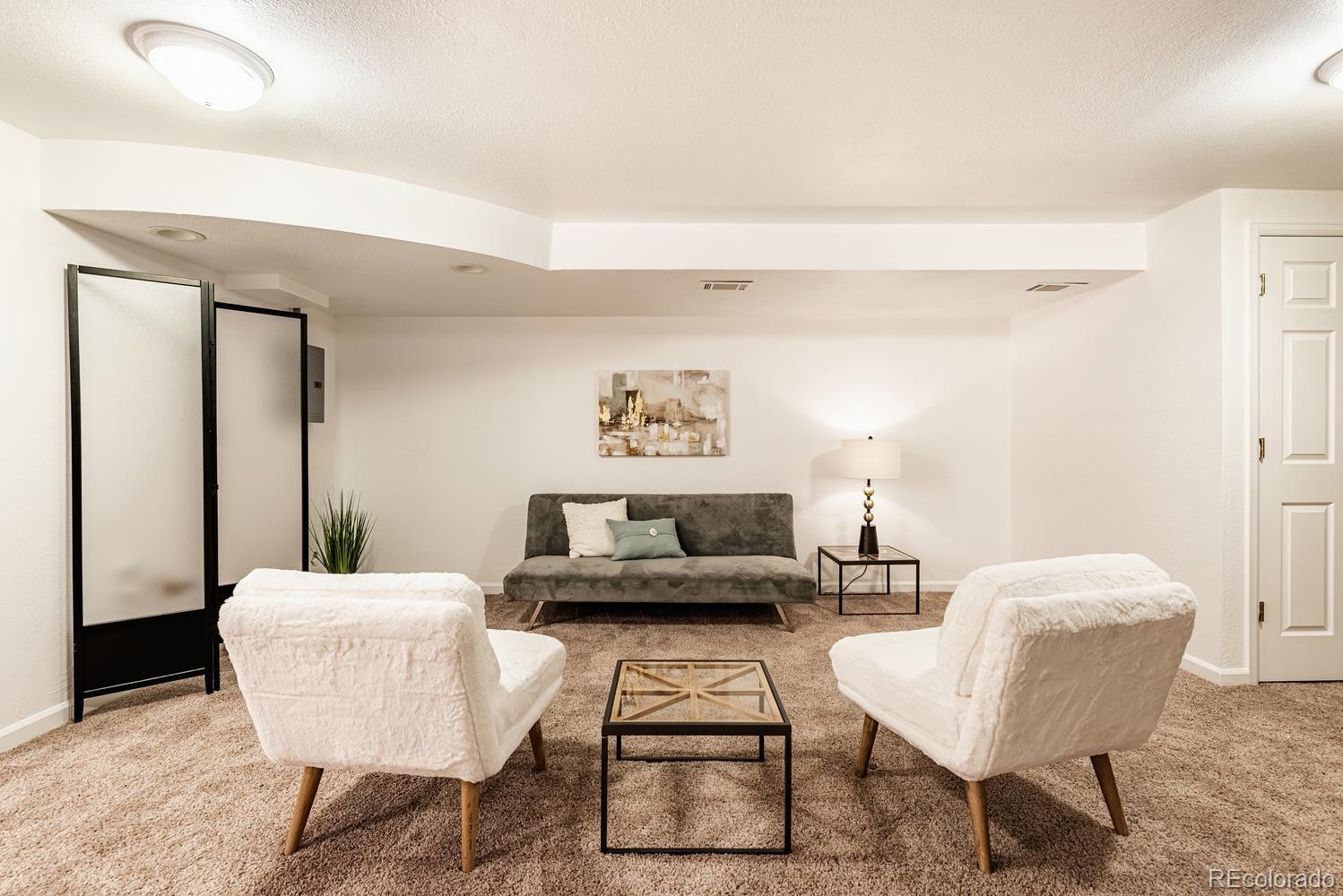 13895 Braun Road Golden, CO 80401 - Photo 22 of 40 a living room with furniture and a potted plant