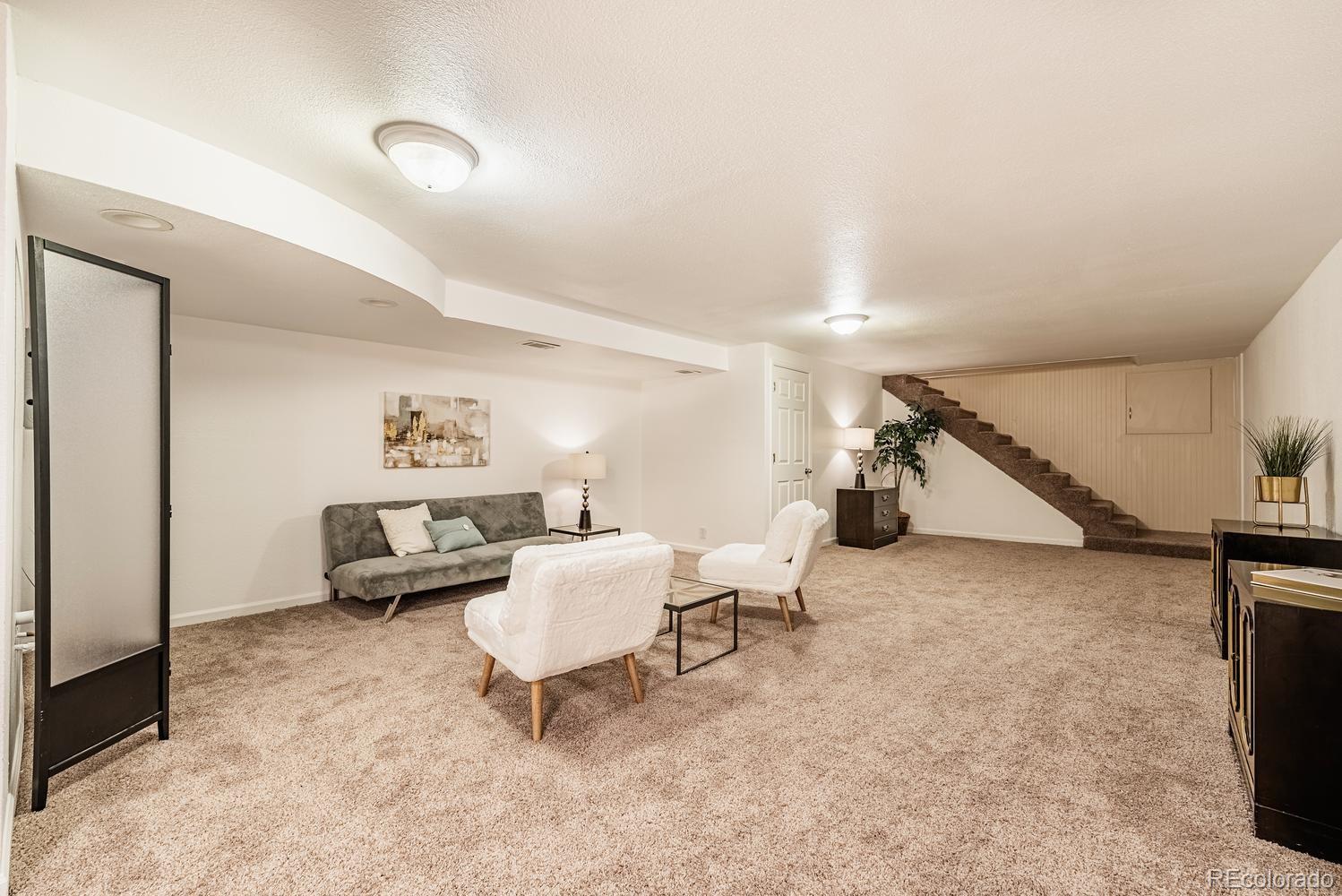 13895 Braun Road Golden, CO 80401 - Photo 23 of 40 a living room with furniture and white walls