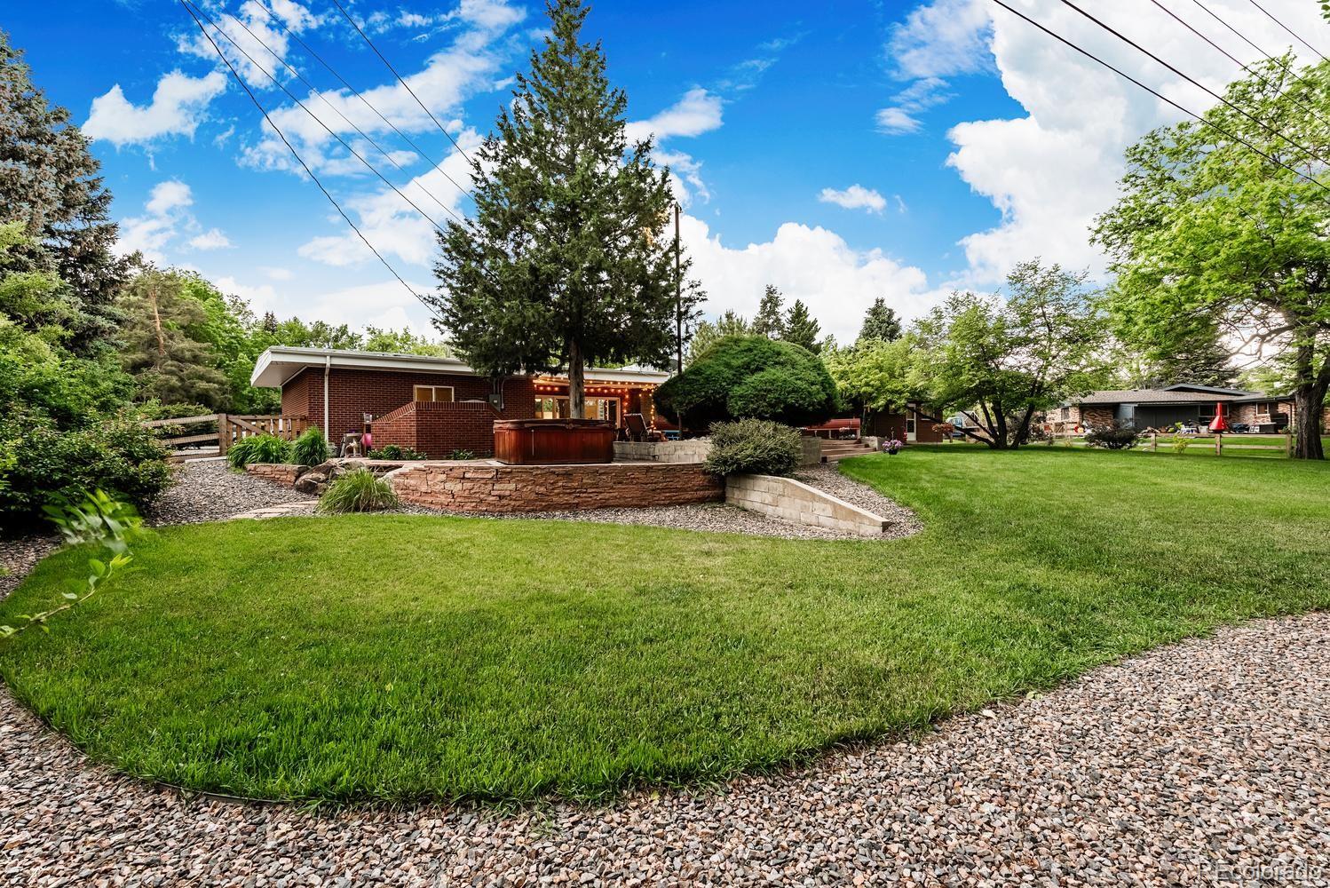 13895 Braun Road Golden, CO 80401 - Photo 34 of 40 a view of a house with backyard sitting area and garden
