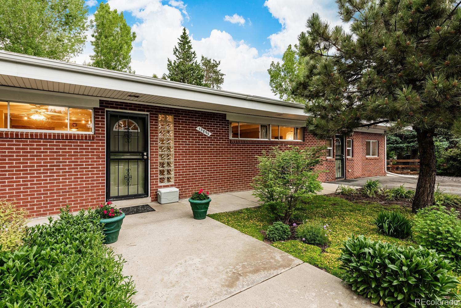 13895 Braun Road Golden, CO 80401 - Photo 4 of 40 a front view of a house with garden