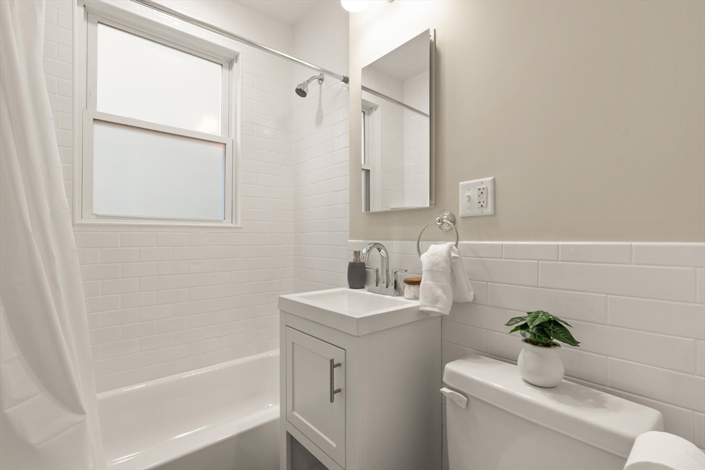 60 Crescent Street, Unit 1 Cambridge, MA 02138 - Photo 16 of 25 a bathroom with a sink a toilet and shower