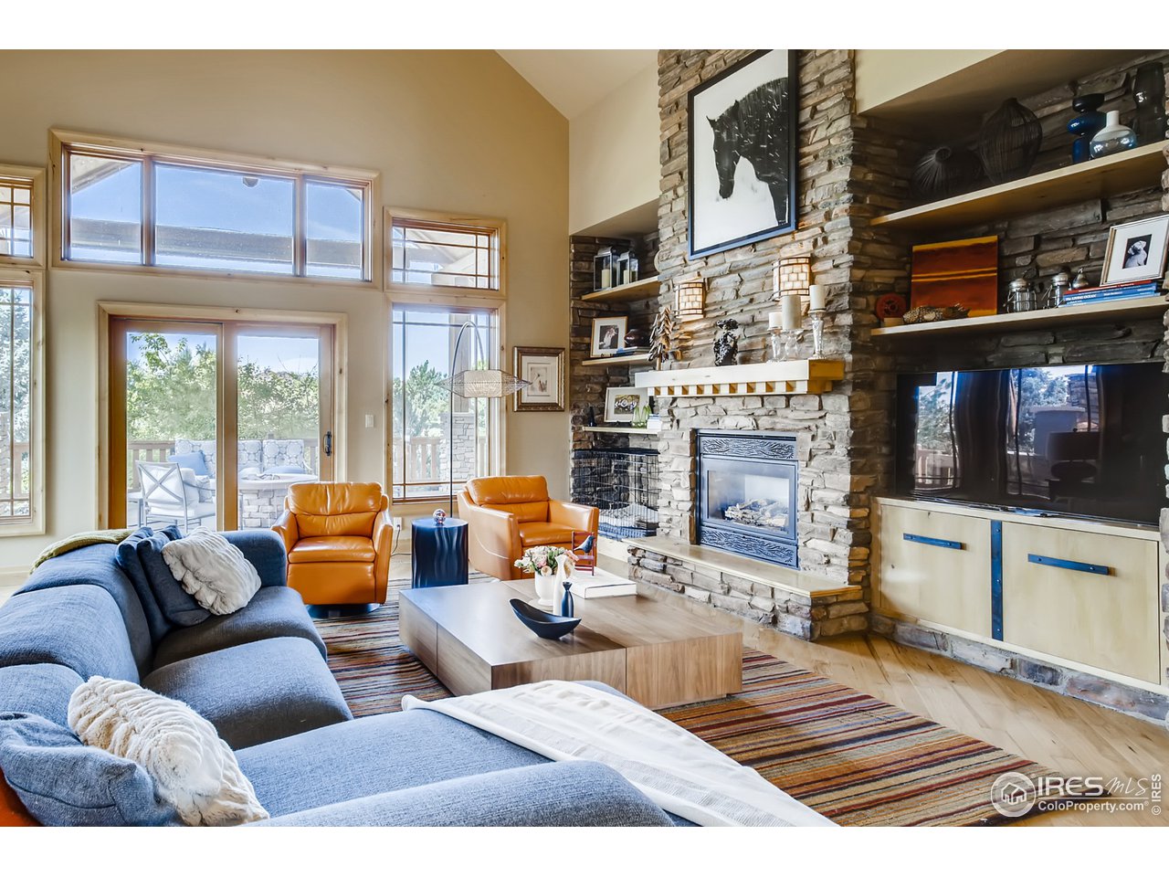 10484 Sunlight Drive Lafayette, CO 80026 - Photo 12 of 40 a living room with furniture fireplace and flat screen tv