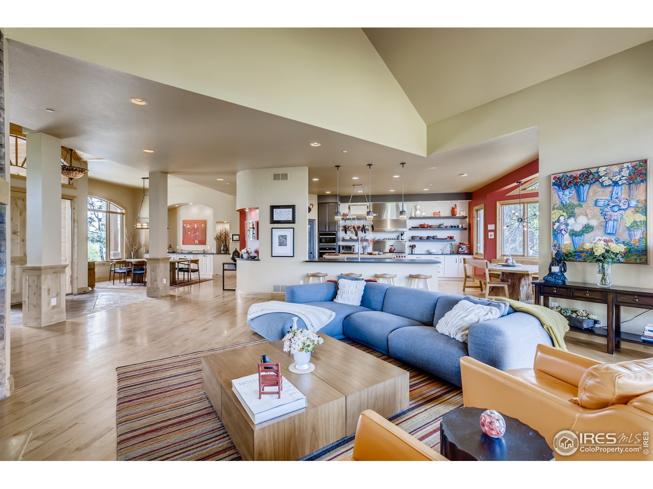 10484 Sunlight Drive Lafayette, CO 80026 - Photo 13 of 40 a living room with furniture kitchen view and a wooden floor