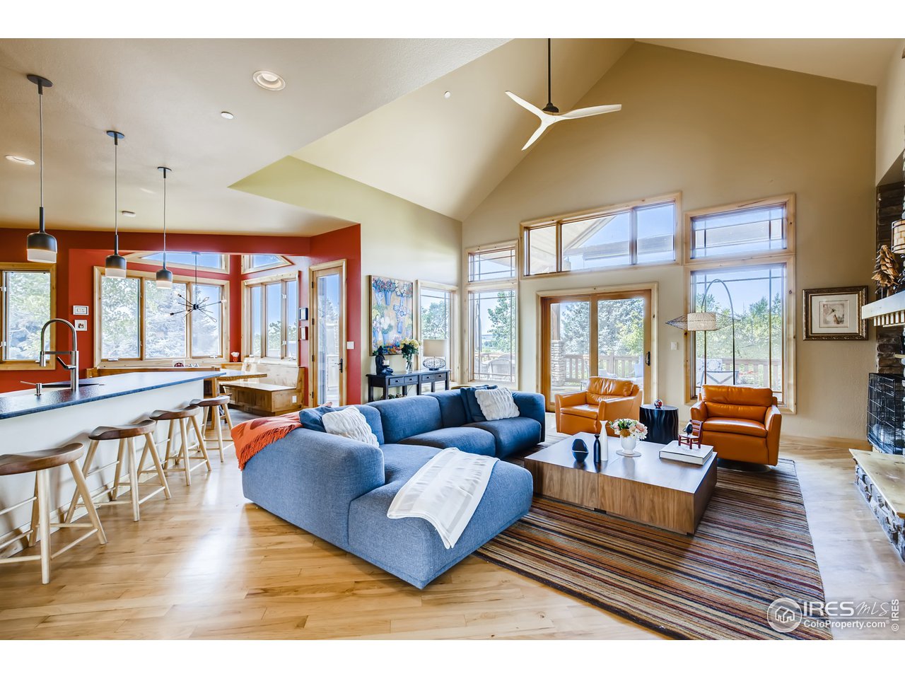10484 Sunlight Drive Lafayette, CO 80026 - Photo 14 of 40 a living room with furniture wooden floor and a large window