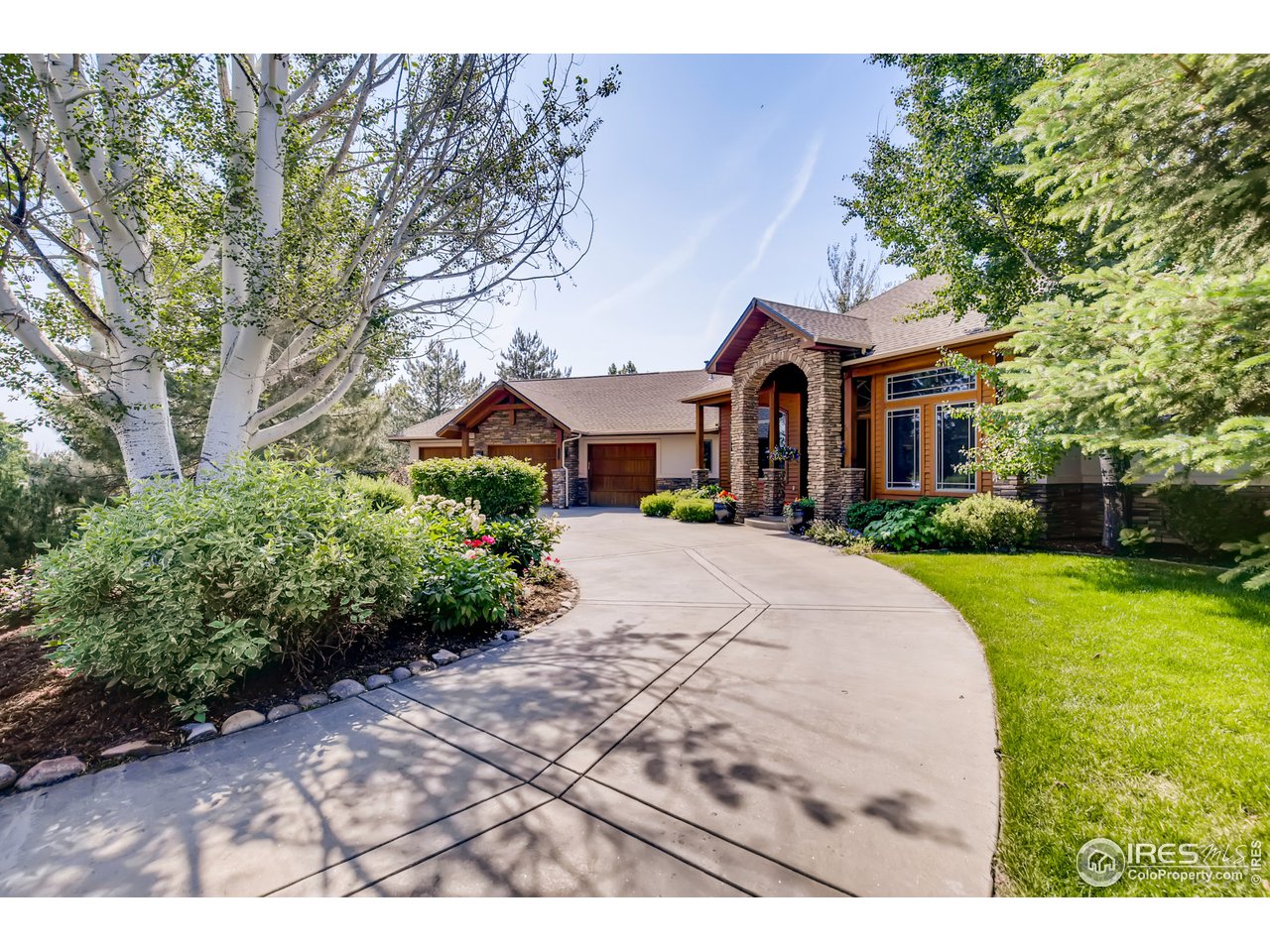 10484 Sunlight Drive Lafayette, CO 80026 - Photo 2 of 40 a front view of a house with a yard