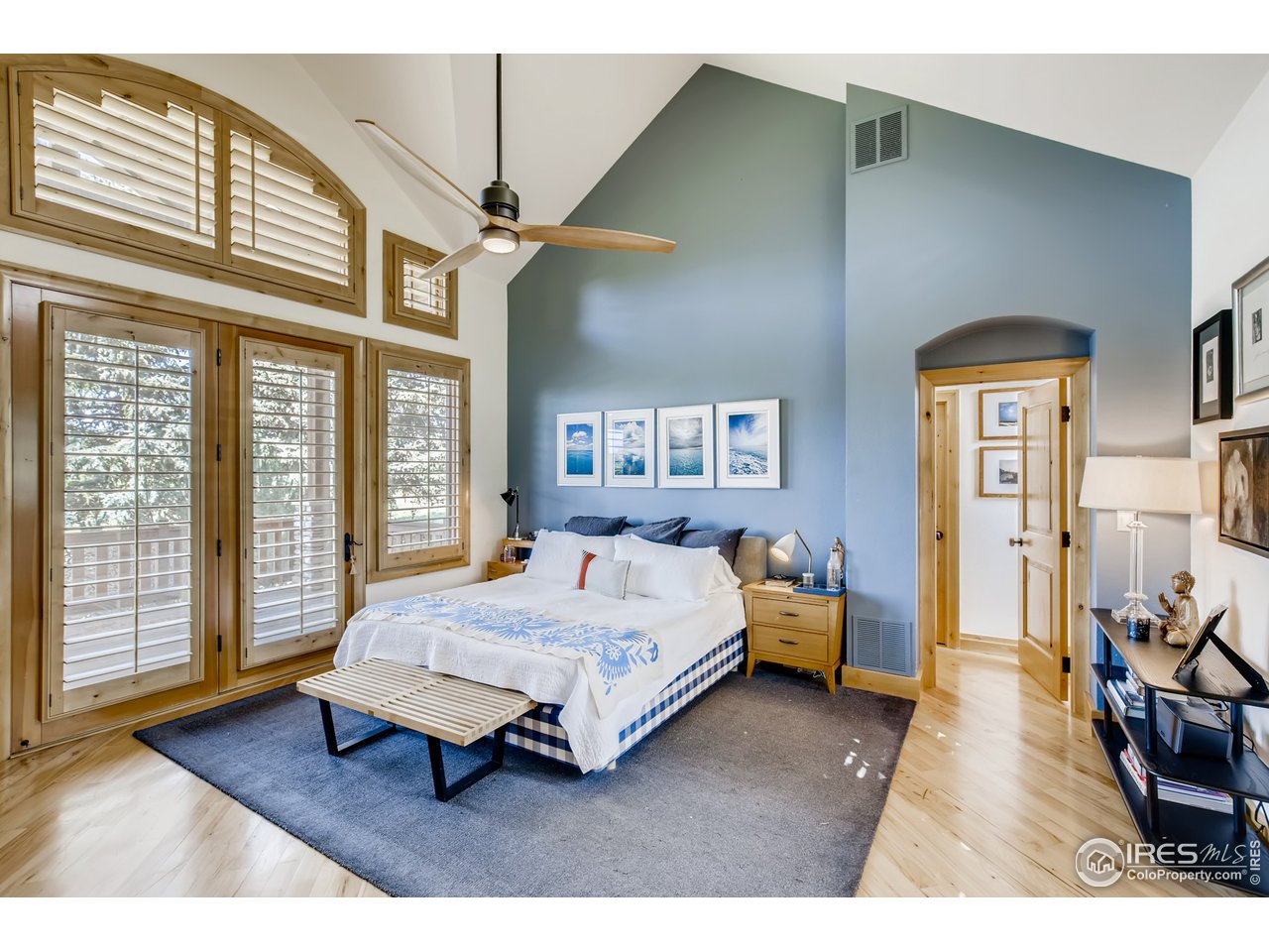 10484 Sunlight Drive Lafayette, CO 80026 - Photo 21 of 40 a bedroom with a bed and wooden floor
