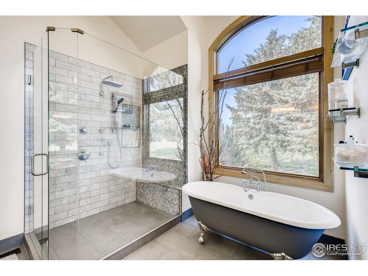 10484 Sunlight Drive Lafayette, CO 80026 - Photo 23 of 40 a bathroom with a bathtub and a shower