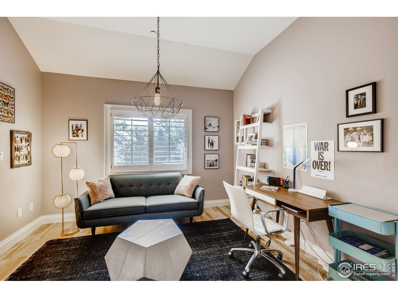 10484 Sunlight Drive Lafayette, CO 80026 - Photo 24 of 40 a living room with furniture and a chandelier