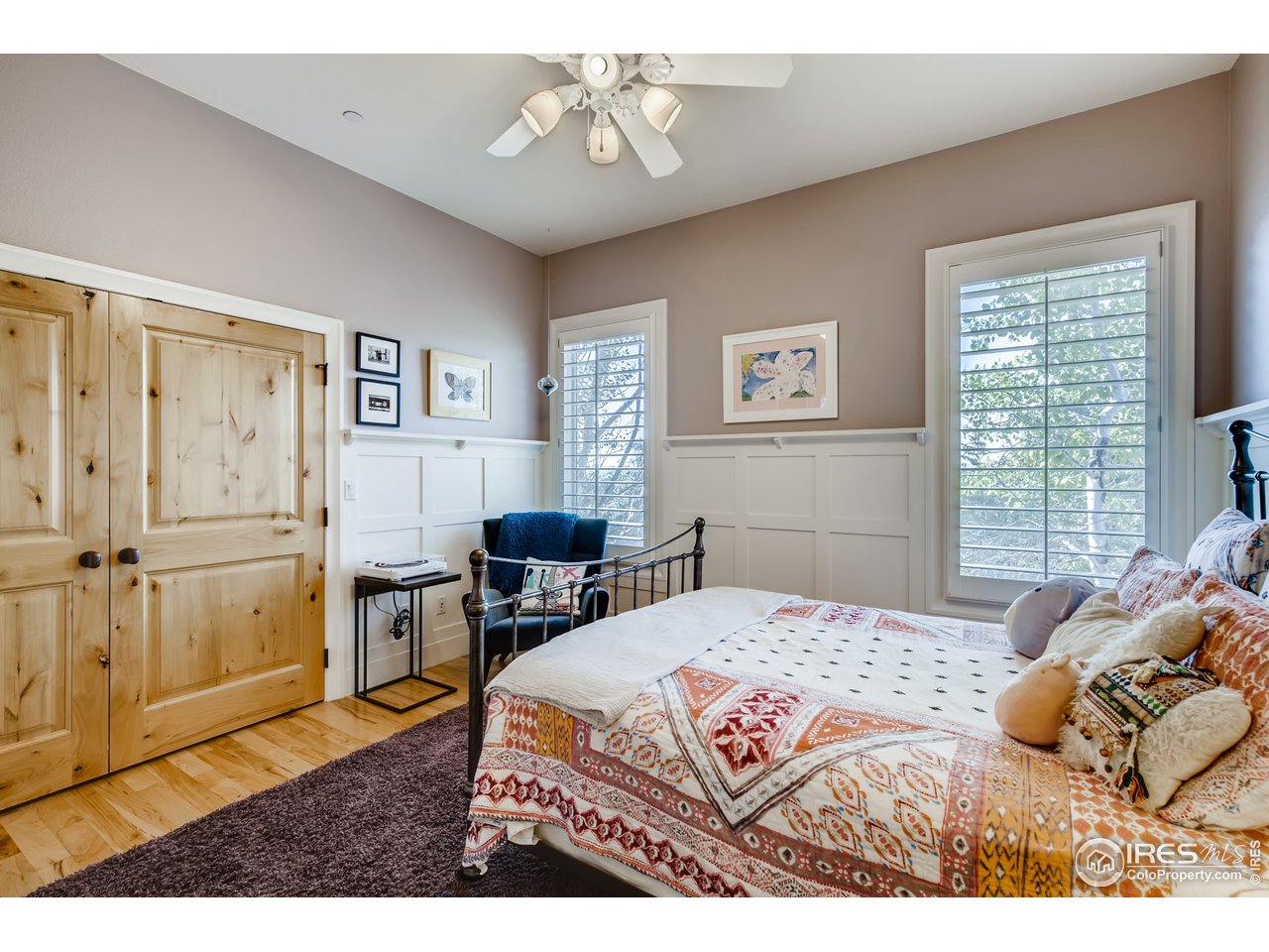 10484 Sunlight Drive Lafayette, CO 80026 - Photo 25 of 40 a bedroom with a bed and wooden floor