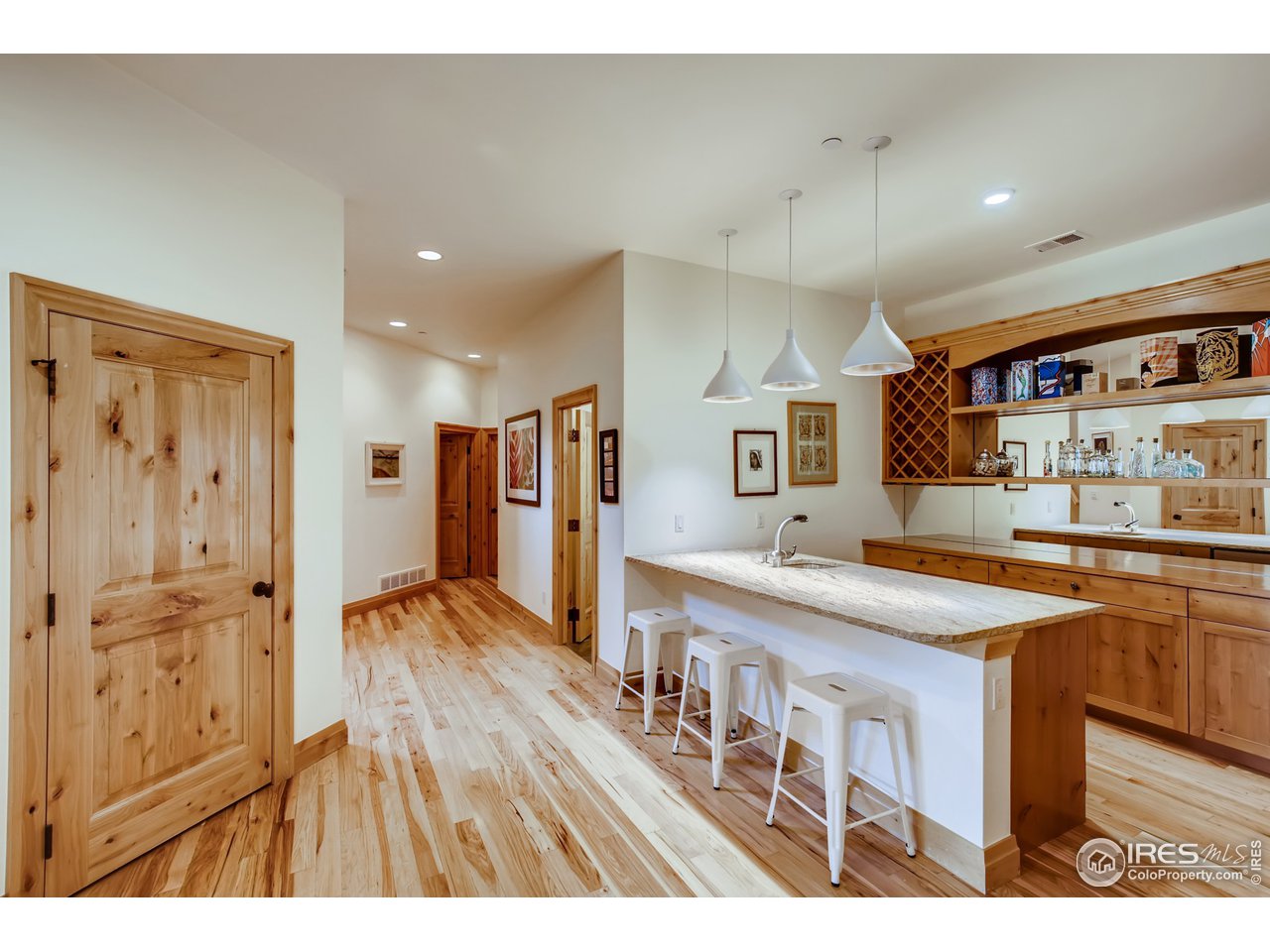 10484 Sunlight Drive Lafayette, CO 80026 - Photo 28 of 40 a open kitchen with stainless steel appliances granite countertop a sink and a refrigerator