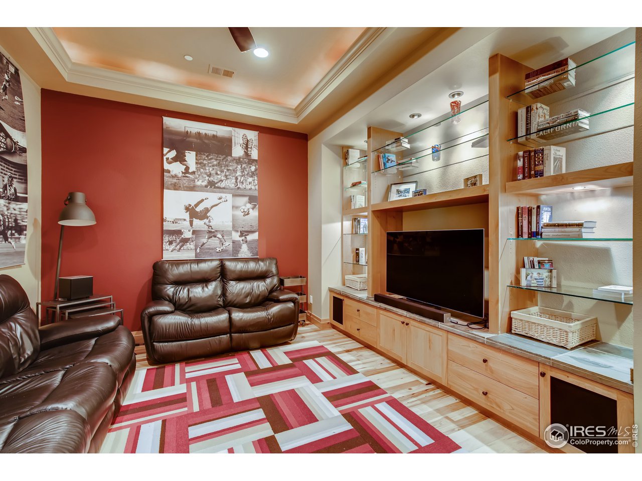 10484 Sunlight Drive Lafayette, CO 80026 - Photo 29 of 40 a living room with furniture and a flat screen tv