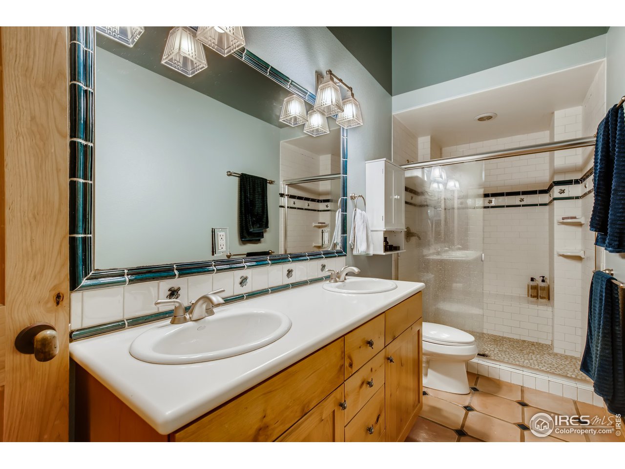 10484 Sunlight Drive Lafayette, CO 80026 - Photo 31 of 40 a bathroom with a sink and a mirror