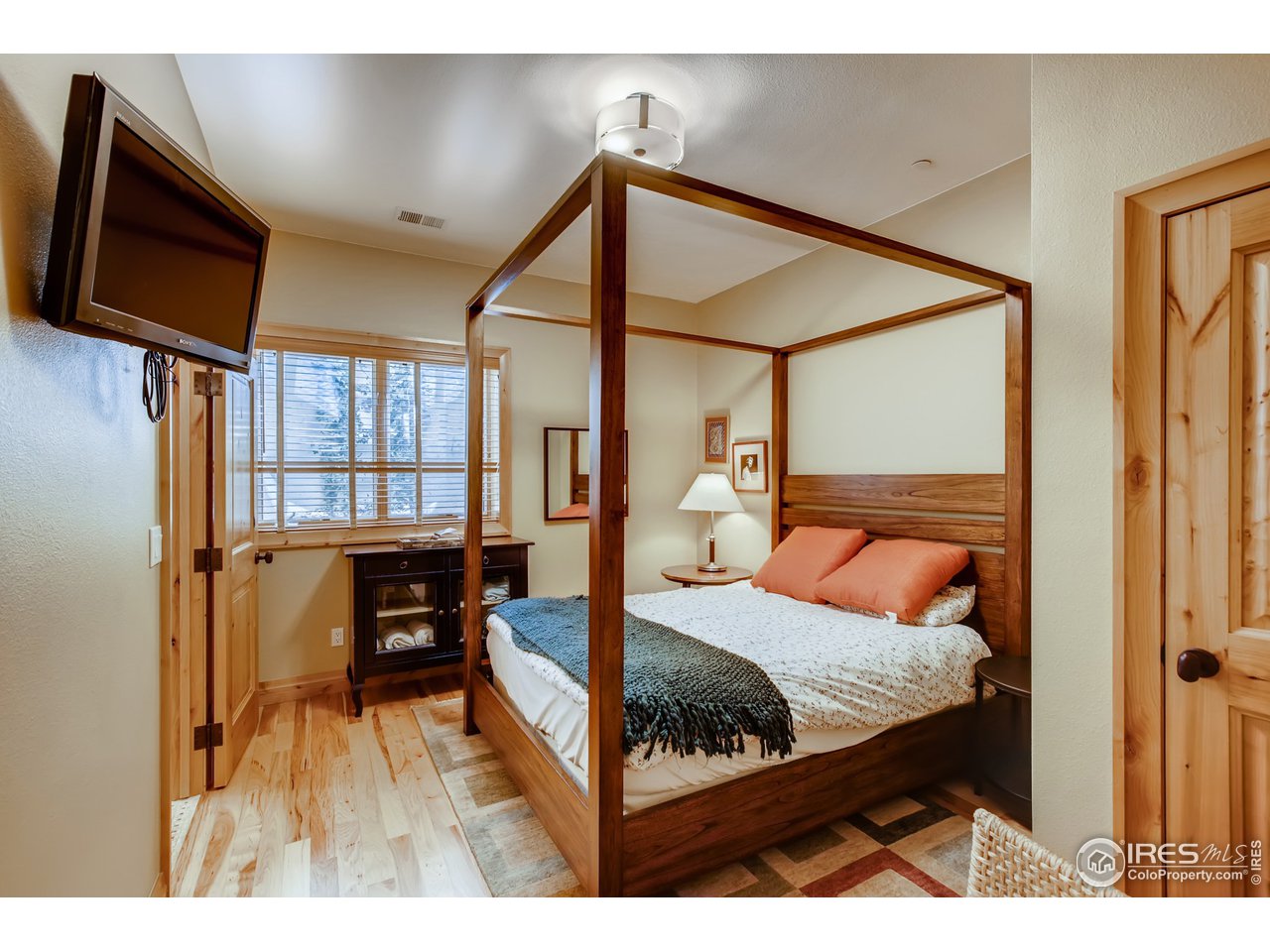 10484 Sunlight Drive Lafayette, CO 80026 - Photo 33 of 40 a bed room with a bed window and a mirror