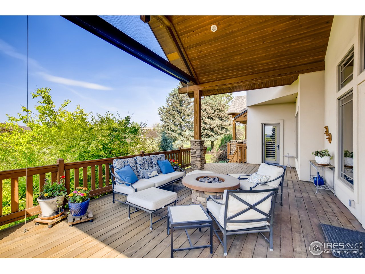 10484 Sunlight Drive Lafayette, CO 80026 - Photo 37 of 40 a outdoor dining space with furniture and wooden floor