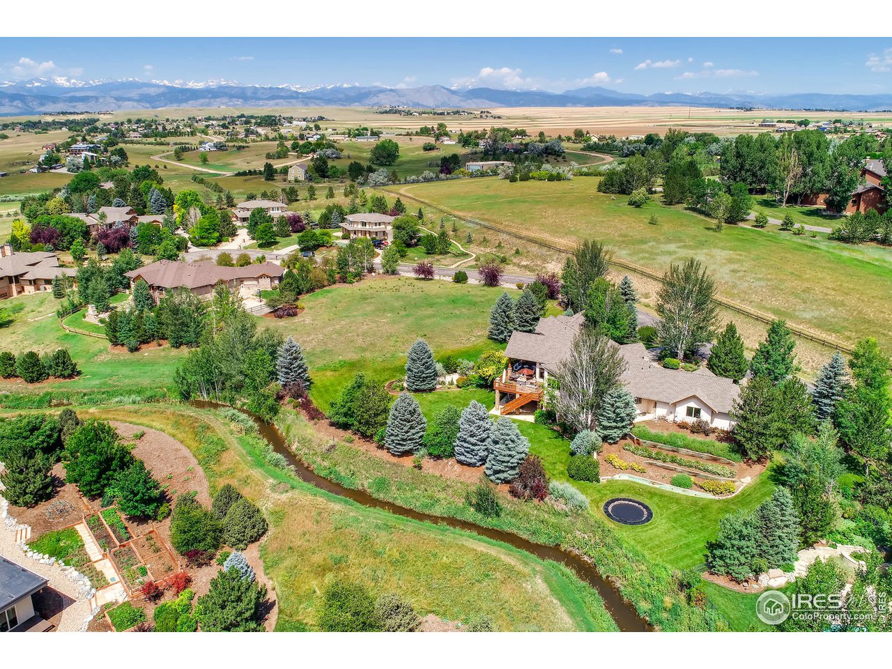 10484 Sunlight Drive Lafayette, CO 80026 - Photo 39 of 40 a view of a city with mountains in the background