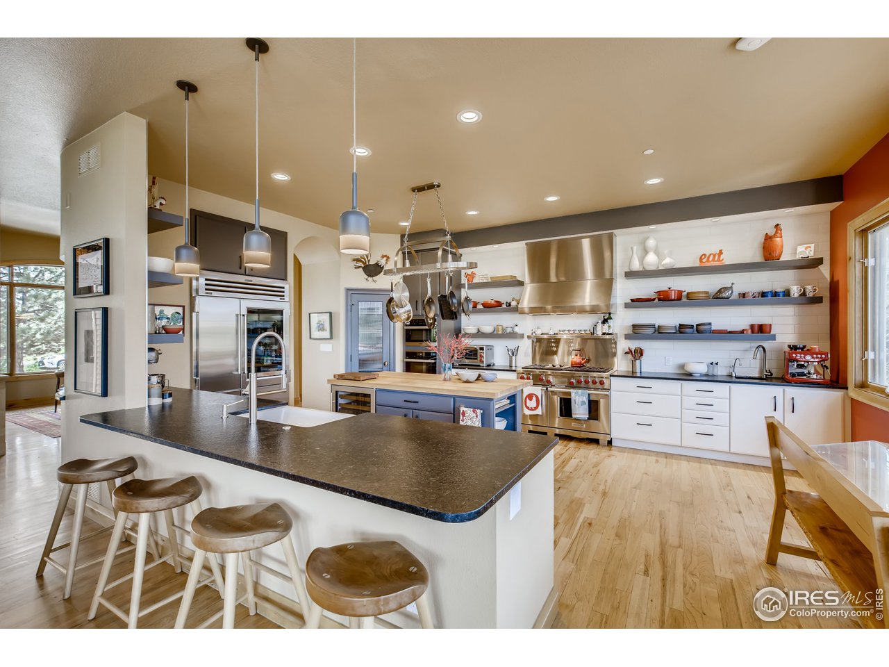 10484 Sunlight Drive Lafayette, CO 80026 - Photo 5 of 40 a kitchen with stainless steel appliances granite countertop a sink and a refrigerator