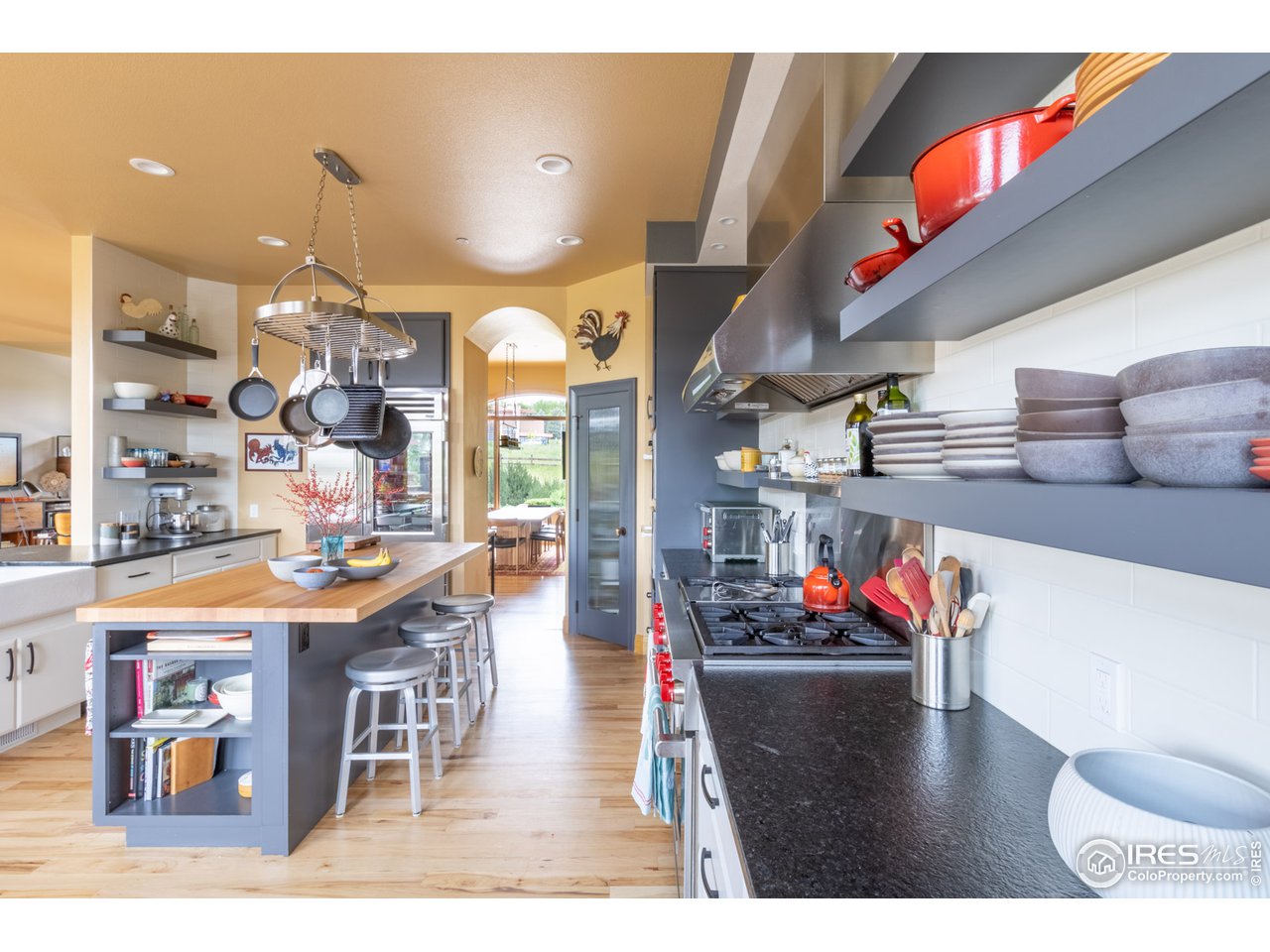 10484 Sunlight Drive Lafayette, CO 80026 - Photo 8 of 40 a room with lots of furniture and chandelier