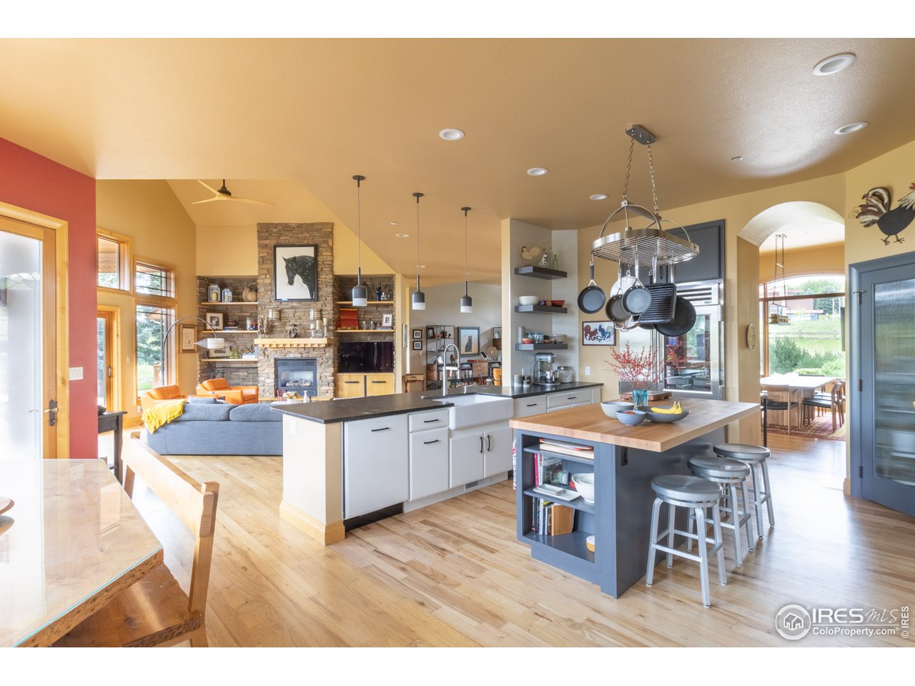 10484 Sunlight Drive Lafayette, CO 80026 - Photo 9 of 40 a kitchen with stainless steel appliances granite countertop a table and chairs in it