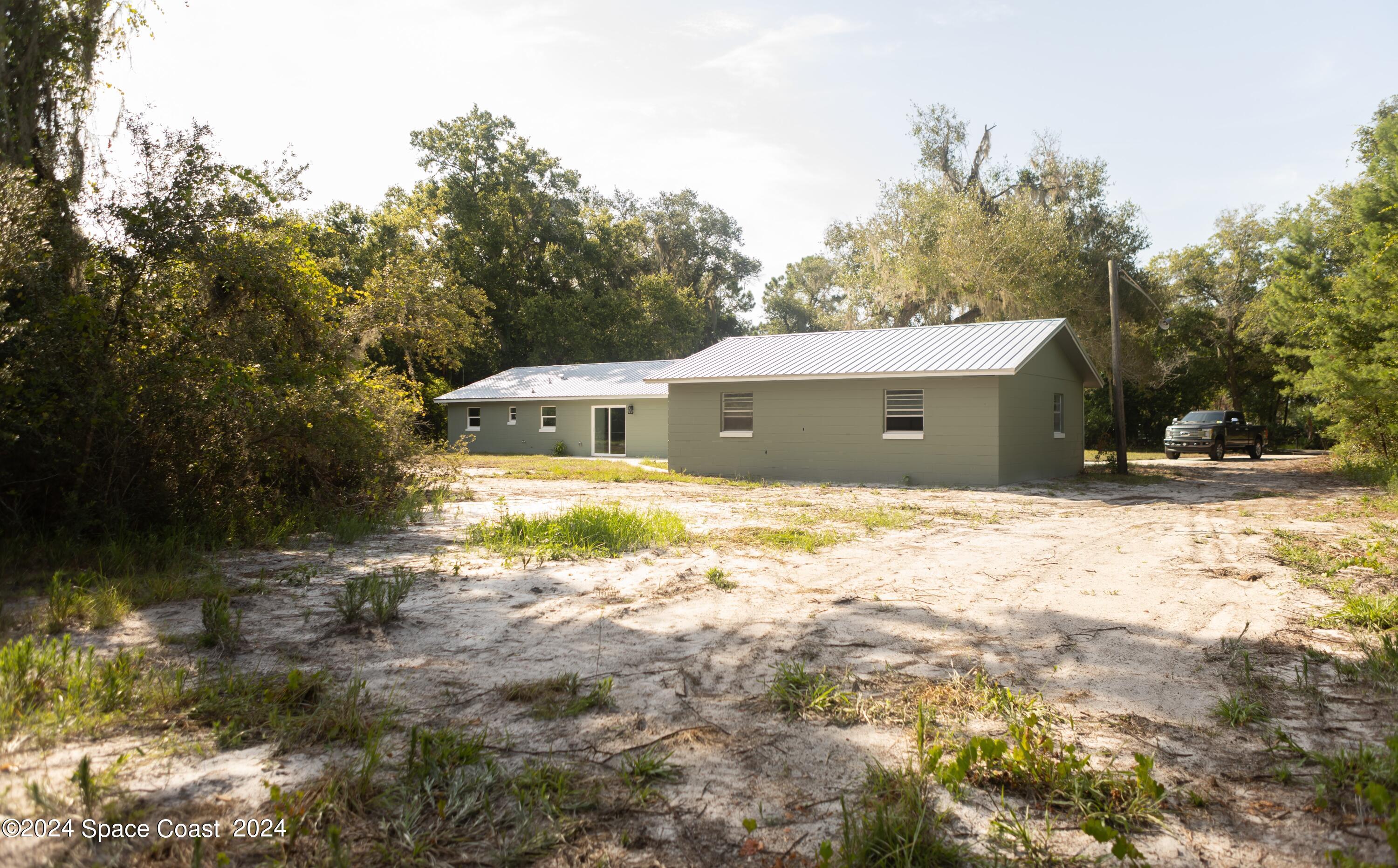 4706 Gandy Road Mims, FL 32754 - Photo 3 of 22 I03A3578