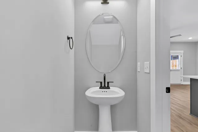 a bathroom with a sink and a mirror