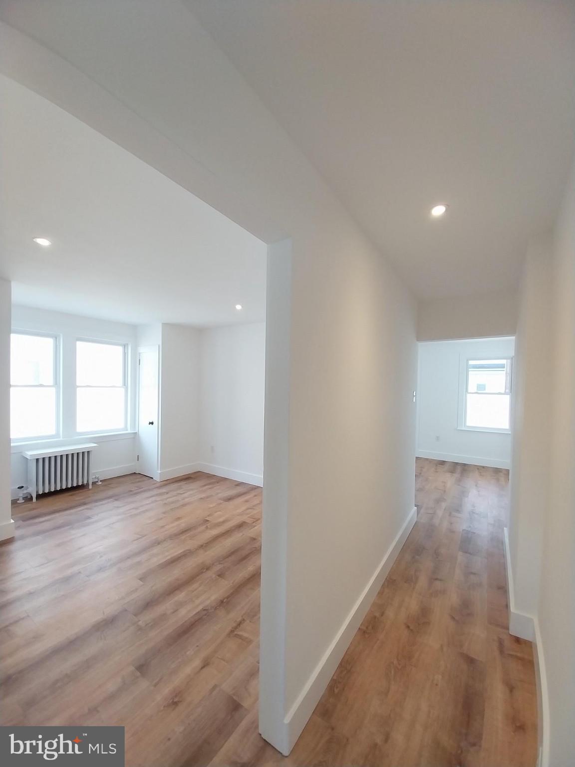 525 New Street Spring City, PA 19475 - Photo 11 of 11 a view of an empty room and window and wooden floor