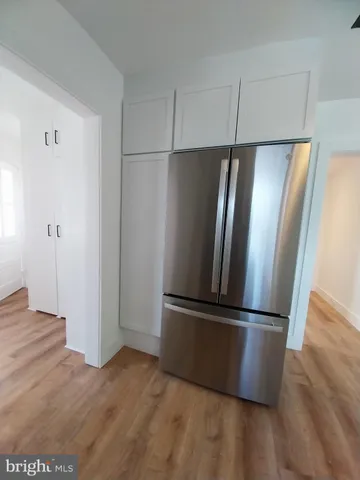 a view of stainless steel appliances with wooden floor