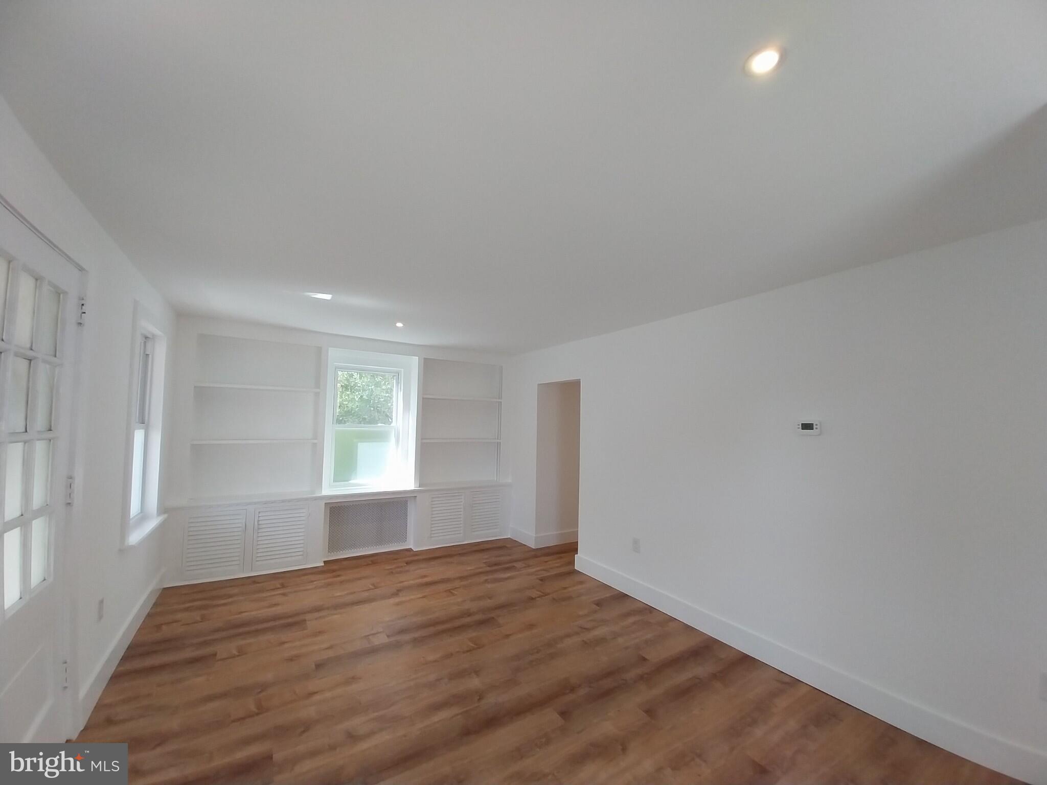 525 New Street Spring City, PA 19475 - Photo 4 of 11 a view of empty room with wooden floor and fan