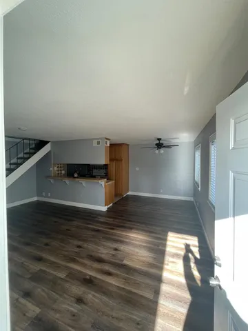 a view of a kitchen cabinets and a wooden floor